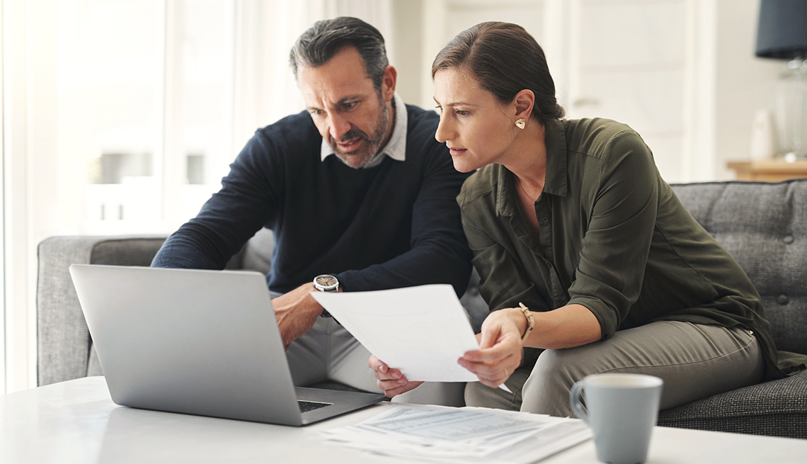 Retirement contribution planning with laptop and notebook