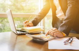 Pension risk transfer concept with benefits document on table